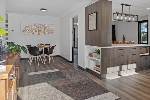 a kitchen with a table and a dining room at Yarra Gables in Healesville