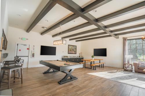 a living room with a ping pong table at Riviera Oaks Resort in Ramona
