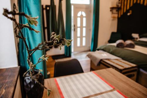 a living room with a vase on a table at Skyway Borsec Connection Hideaway in Borsec
