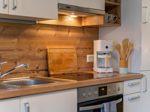a kitchen with a sink and a counter top at Bienenheim in Lehen