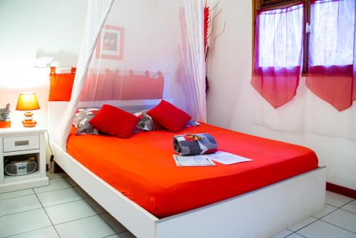 Letto o letti in una camera di Au Jardin Des Colibris Ecolodge&Spa