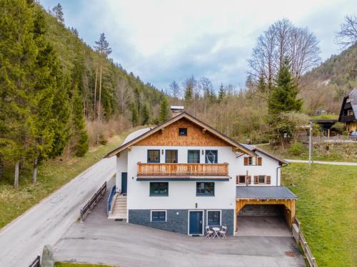 a large white house with a balcony on a road at Bienenheim in Lehen