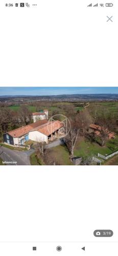 an aerial view of a house with a roof at Le jardin de Mia in Aiguefonde