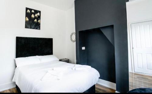 Ένα ή περισσότερα κρεβάτια σε δωμάτιο στο Cambridge House Hotel
