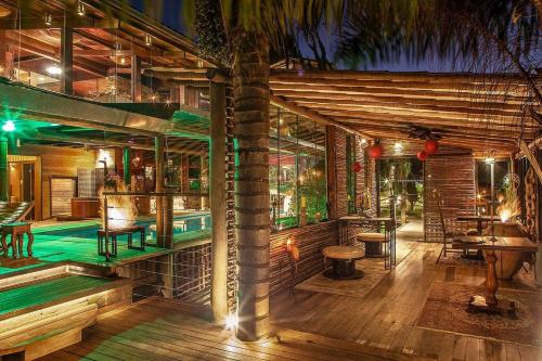 a resort with a swimming pool and a bar at Canto dos Prazeres Lavras Novas in Lavras Novas