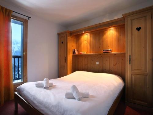 Krevet ili kreveti u jedinici u okviru objekta Apartment on the slopes in the big ski area Grandes Rousses