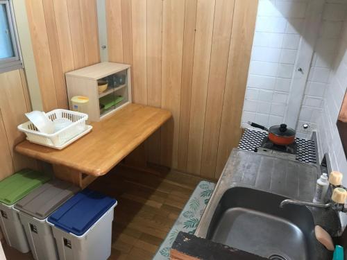 a small kitchen with a counter and a sink at Marine Lodge Umigoya - Vacation STAY 23086v in Zamami