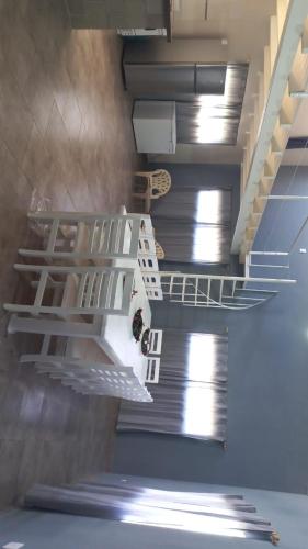 a staircase in a building with white shelves at Quinta elescano in Junín