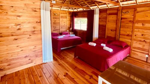 מיטה או מיטות בחדר ב-Lodge ORION - Coté Lagon
