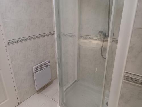 a shower with a glass door in a bathroom at Appartement Hendaye, 2 pièces, 4 personnes - FR-1-239-777 in Hendaye