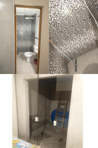 a bathroom with a glass door and a toilet at Casa Tranquila em Itu in Itu