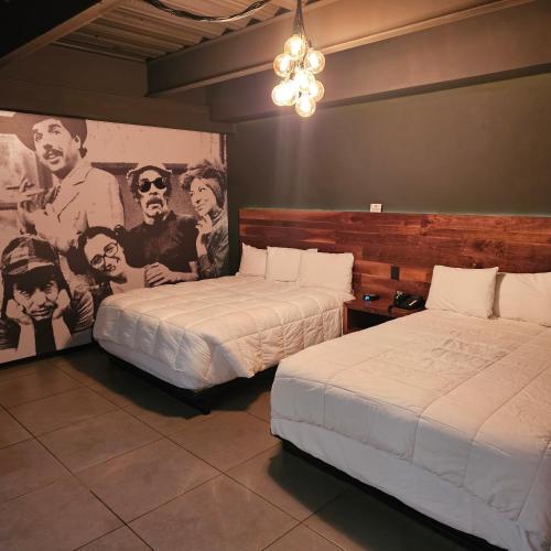 Postel nebo postele na pokoji v ubytování HOTEL RIO RITA