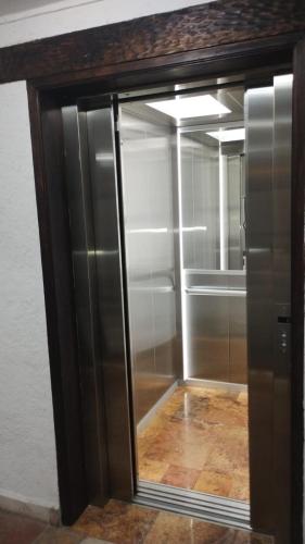 an empty walk in closet with a glass door at HOTEL PLAZA SAN CRISTOBAL INN in San Cristóbal de Las Casas