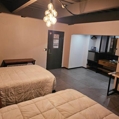 Postel nebo postele na pokoji v ubytování HOTEL RIO RITA