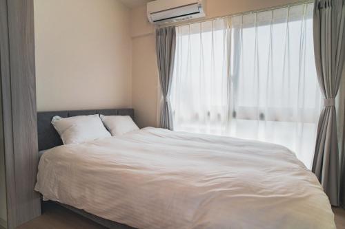 Katil atau katil-katil dalam bilik di Star Residence - 博多上呉服