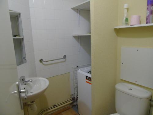 a small bathroom with a toilet and a sink at Appartement Valfréjus, 3 pièces, 8 personnes - FR-1-561-112 in Modane