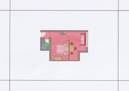 a floor plan of a room with pink walls at Hotel & Appartement Auerhahn in Obertauern