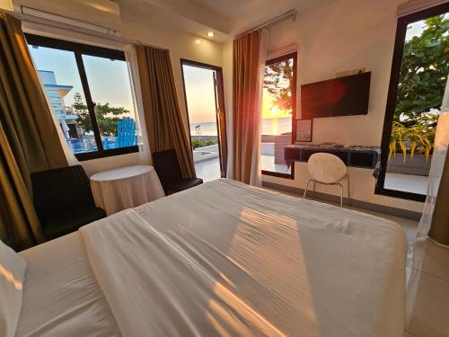 Katil atau katil-katil dalam bilik di Blue Coast Beach Hotel