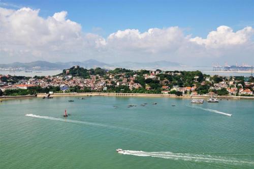 a group of people on a boat in the water at Xiamen Seashine Lakeview Hotel in Xiamen