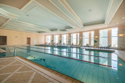 a large swimming pool in a large building at Nagoya Marriott Associa Hotel in Nagoya