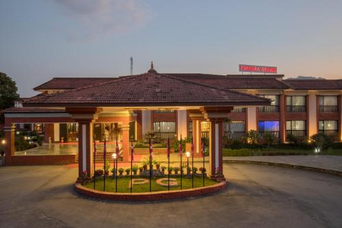 a hotel with a gazebo in front of a building at Hotel Pokhara Grande in Pokhara