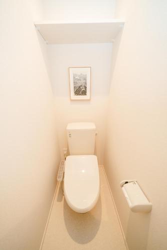 a bathroom with a toilet in a small room at Simple Stay Minoshima セルフチェックイン in Fukuoka