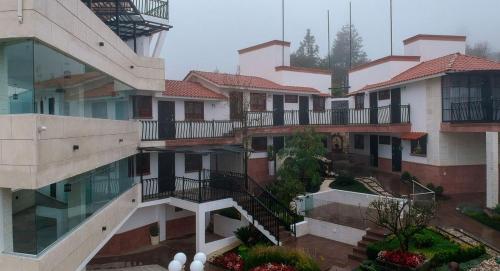 an aerial view of a building with balconies at Hotel Royalinglés in Mineral del Monte