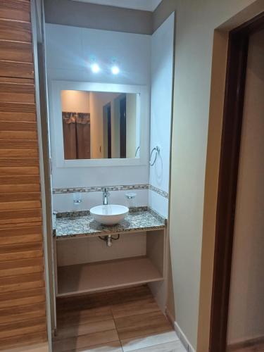 a bathroom with a sink and a mirror at Los Nogales in San Rafael