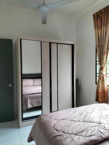 a bedroom with a bed and a large window at IRIS 31 Corner Lot Near Legoland JDT UTM Malay Only in Johor Bahru