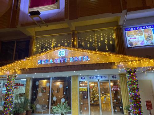 a store front with christmas lights and christmas decorations at HERACITY Hotel in Pamukkale