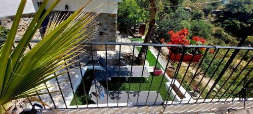 an aerial view of a balcony with plants and flowers at Villa Sarichel in Nikithianós