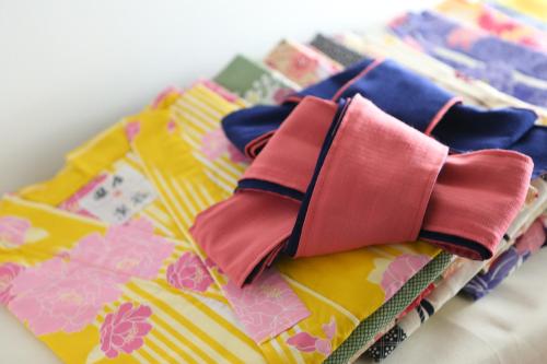 a bunch of ties sitting on top of a table at 志賀高原 白い温泉 渓谷の湯 in Yamanouchi