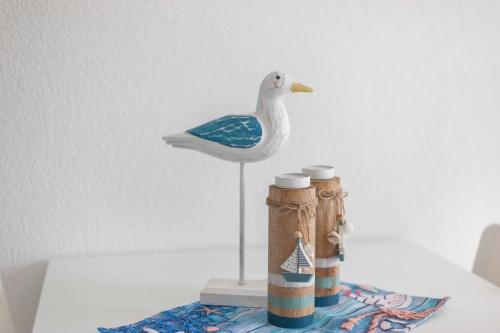 a plastic bird sitting on top of a table at Strandnaher Bungalow in Dierhagen