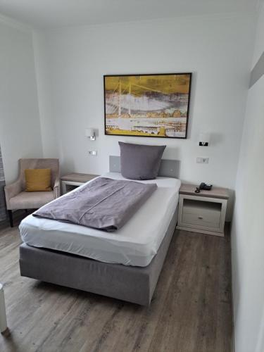 Postel nebo postele na pokoji v ubytování Hotel Angerland Garni