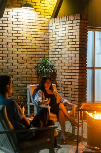 a woman sitting in a chair in a room at Hokke Lumbini in Lumbini