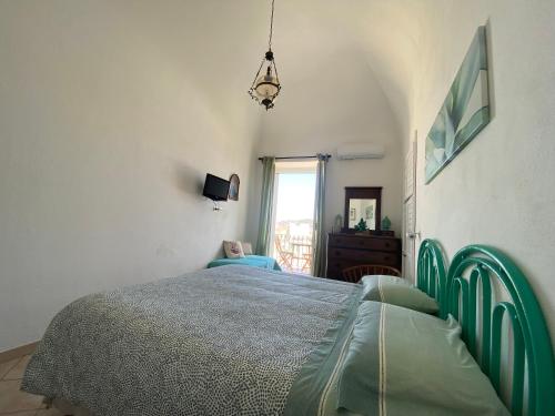 A bed or beds in a room at La fortezza