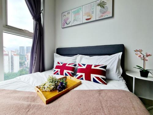 a bed with a tray of food on top of it at Garden Duplex Studio 7 Guest Old Klang Road Kuala Lumpur Mid Valley Pearl Point Bangsar Bangsar South Bukit Jalil Taman Desa ML in Kuala Lumpur