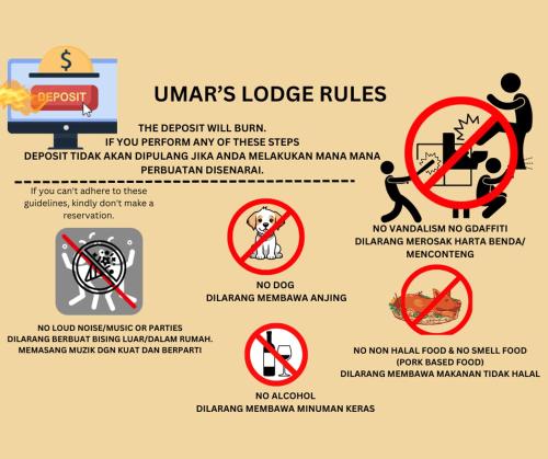 Una señal que lee las reglas de la guerra. en Umar's Lodge en Bemban