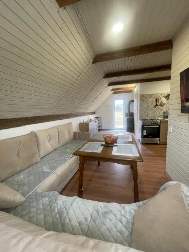 a living room with a couch and a table at White House Žabljak in Žabljak