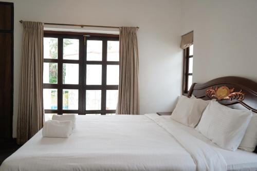 Postel nebo postele na pokoji v ubytování Richmonde Ananta Elite Luxurious Villa & Apartments,Goa