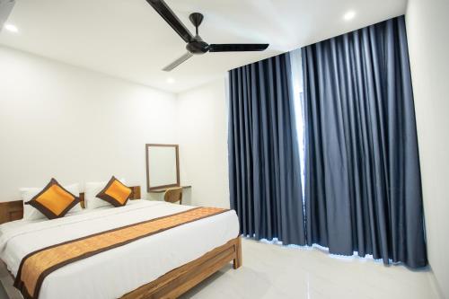 Katil atau katil-katil dalam bilik di Palm Beach Hotel Phu Yen - Kite surfing spot in winter