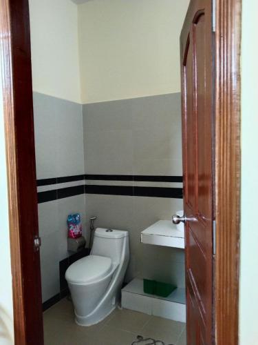 a bathroom with a toilet and a sink at Room 12 - Studio in a villa 5mn walk from the Royal Palace with swimming pool in Phnom Penh