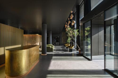 a lobby of a building with black walls and ceilings at VISIONAPARTMENTS Glattbrugg in Glattbrugg