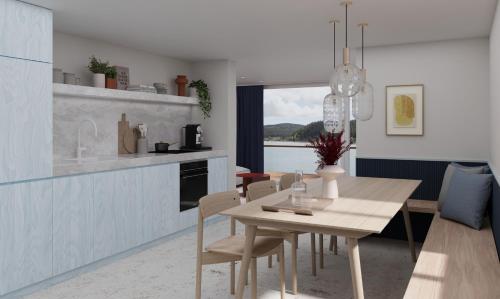 a kitchen and dining room with a table and chairs at stuub schluchsee in Schluchsee