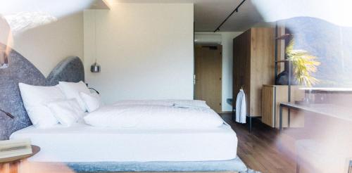 Postel nebo postele na pokoji v ubytování Hotel Paradies