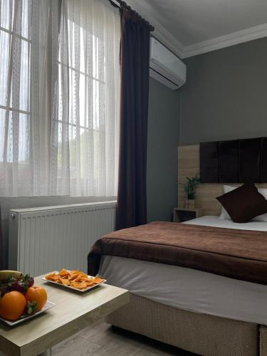 Ένα ή περισσότερα κρεβάτια σε δωμάτιο στο PUGARi HOTEL