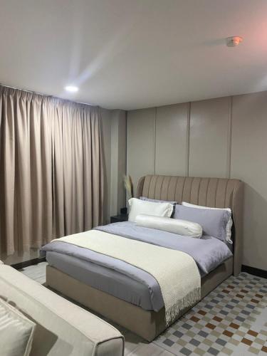 a bedroom with two beds and a window at 1st Living Subang SS15 in Subang Jaya