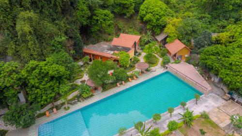 an aerial view of a house with a large swimming pool at Trang An Hometown Homestay in Ninh Binh