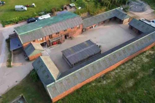 an overhead view of a house with a garage at Sleep next to a Horse in a stable by the city ! in Exeter