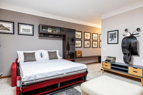 a bedroom with a bed and a motorcycle on the wall at "Once Upon A Time" Cherubini Palace Thematic Apartments Free Parking in Florence